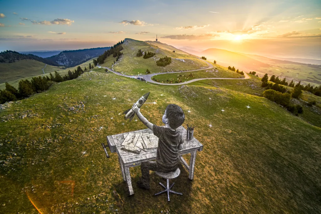 Saypes Kunstwerk auf dem Chasseral, ein Kind an der Werkbank mit einer aufsteigenden Rakete